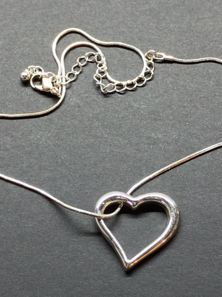 Silver Tone Heart Pendant And Chain